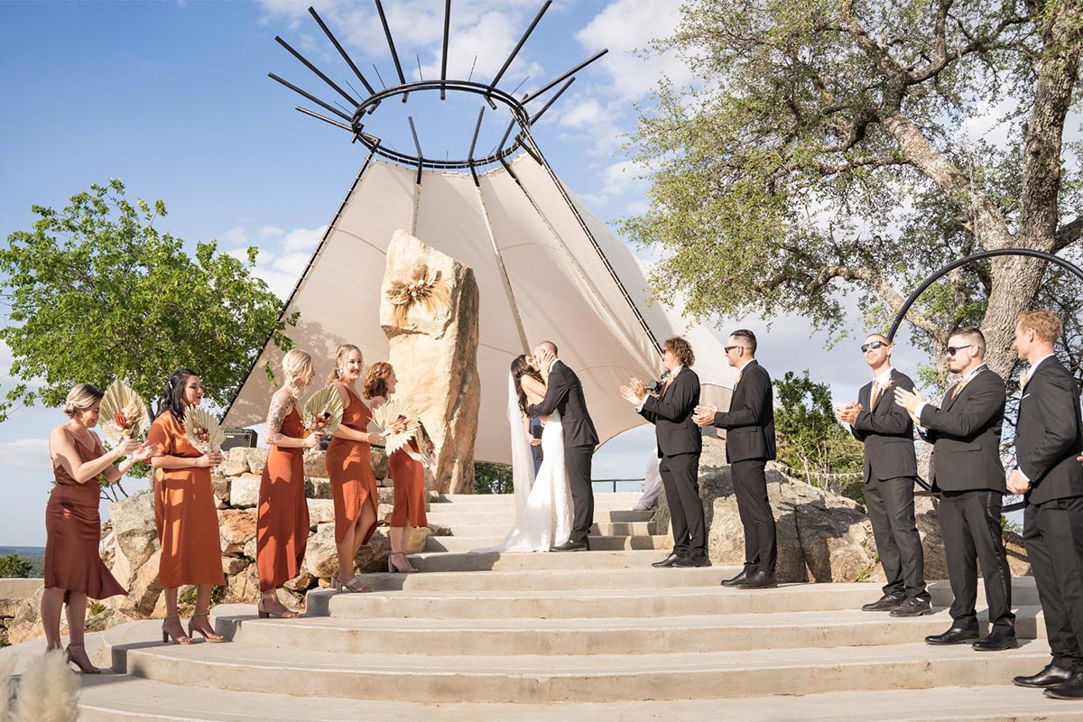 A ceremony on the stone steps beneath the tipi