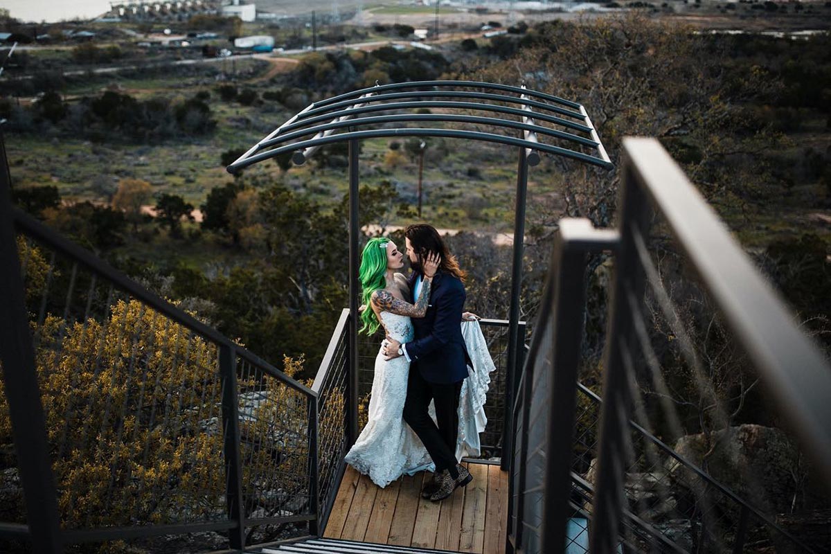 A couple on a deck overlooking the Hill Country